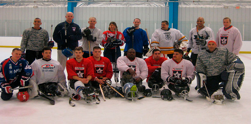 hockey team on ice in multi-colored jerseys