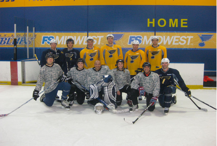 hockey team on ice in yellow jerseys